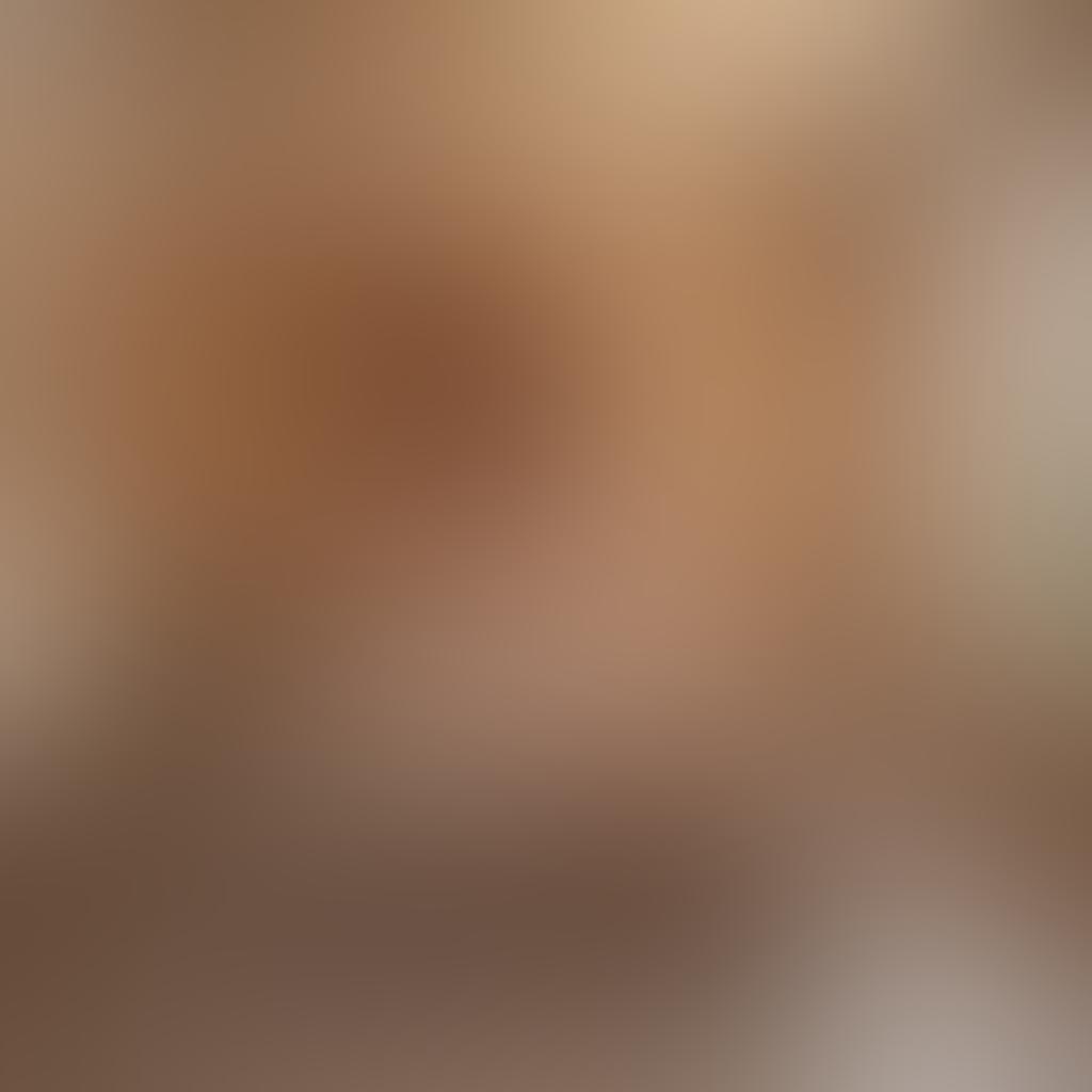 A stylish and inviting bedroom softly lit with warm tones, featuring an aesthetically pleasing arrangement of casual yet elegant decor. A subtle hint of allure is present with artistic nude portraits on the walls, conveying beauty and intimacy without being explicit. The room is adorned with plush, trendy furnishings and an open window that lets in soft breezes, suggesting a sense of freedom and relaxation. The overall mood is both approachable and sophisticated, appealing to a modern audience. super-realistic. warm colors. intimate lighting.